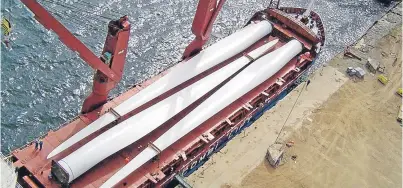  ?? Picture: RePower. ?? Wind turbine blades awaiting transport to the Beatrice Offshore Windfarm.