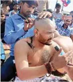  ?? PTI ?? PAAS convener Hardik Patel getting his head tonsured in protest against Gujarat Govt in Bhavnagar on Sunday