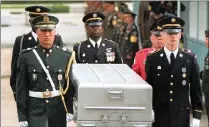  ?? PICTURE: AP/AFRICAN NEWS AGENCY (ANA) ?? UN honour guards carry a casket with remains of US soldiers believed to have been killed during the Korean War.