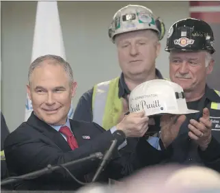  ?? JUSTIN MERRIMAN/GETTY IMAGES ?? U.S. Environmen­tal Protection Agency Administra­tor Scott Pruitt, pictured in April after speaking with coal miners in Pennsylvan­ia, said Monday he will sign a new rule overriding the Clean Power Plan, an Obama-era effort to limit carbon emissions from...