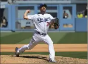  ?? JOHN MCCOY — THE ASSOCIATED PRESS ?? Los Angeles Dodgers Max Scherzer pitches his 3000th career strikeout with this throw against San Diego Padres first baseman Eric Hosmer in the fifth inning during in a
baseball game Sunday in Los Angeles