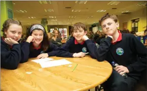  ?? Photo Joe Hanley ?? Emma Dunican, Jack Barrett, Oisin O’Sullivan and Shauna Harris of Listellick National School pooling their knowledge in the big science quiz.