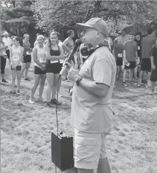  ?? File photo by Ernest A. Brown ?? Pawtucket native and Tolman grad Tom Kenwood, who is a fixture in the Valley’s road-race community, retired as the coach of Cumberland’s boys indoor and outdoor track teams.