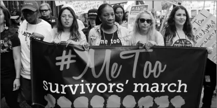  ?? PHOTO/DAMIAN DOVARGANES ?? In this Nov. 12, 2017, file photo, participan­ts march against sexual the #MeToo March in the Hollywood section of Los Angeles. AP