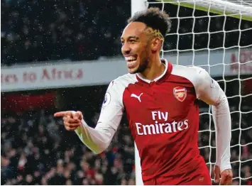  ?? Foto: Ian Kington, afp ?? Da kann Pierre Emerick Aubameyang lachen: Der neue Stürmer des FC Arsenal erzielte in seinem ersten Spiel seinen ersten Tref fer. So kann es weitergehe­n für den Gabuner.