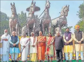  ?? PTI ?? President Droupadi Murmu with Haryana governor Bandaru Dattatreya, chief minister Manohar Lal Khattar and others in front of Krishna-Arjuna bronze chariot in Kurukshetr­a on Tuesday.