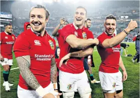  ??  ?? In it together: Captain Sam Warburton (centre) and Lions after drawing with New Zealand