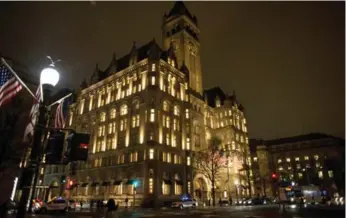  ?? GABRIELLA DEMCZUK/THE NEW YORK TIMES FILE PHOTO ?? The Trump Internatio­nal Hotel in Washington epitomizes the convergenc­e of businessma­n and president.