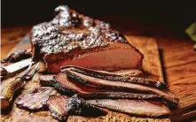  ?? H-E-B ?? H-E-B has collaborat­ed with chef/ pitmaster Ronnie Killen of Killen’s Barbecue in Pearland on a fully cooked smoked brisket, now available in its Greater Houston stores.