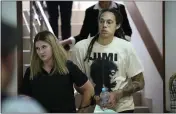  ?? ALEXANDER ZEMLIANICH­ENKO — THE ASSOCIATED PRESS ?? WNBA star and two-time Olympic gold medalist Brittney Griner is escorted to a courtroom for a hearing in Khimki just outside Moscow, Russia, on Friday.