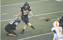  ?? CHRISTOPHE­R HANEWINCKE­L/ USA TODAY SPORTS ?? Vanderbilt Commodores kicker Sarah Fuller converts an extra point against Tennessee Saturday, becoming the first woman to score in a Power Five football game.