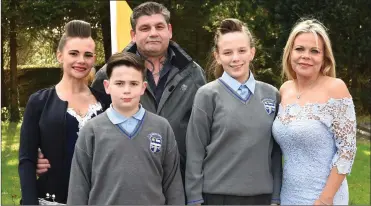  ??  ?? Taylor and Tamzin Lee who made their Confirmati­on with their parents Martina and sister Kelly at Holy Cross Church, Kenmare on Tuesday.