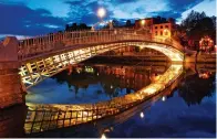  ?? PROVIDED TO CHINA DAILY ?? The Ha’penny Bridge in Dublin, Ireland, is one of the city’s main attraction­s. The first direct flight linking the Chinese mainland and Ireland is scheduled to start operating on June 12.