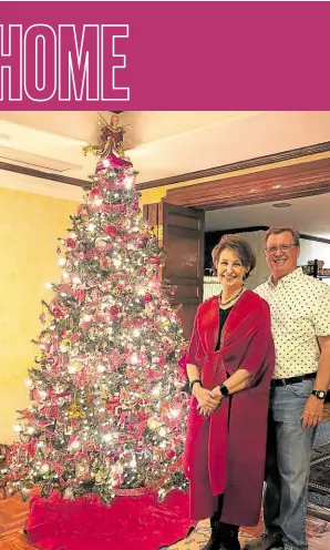  ?? ?? US Ambassador MaryKay Carlson and husband Aubrey with their 21-year-old tree that bears the ornaments their family has collected over the years.