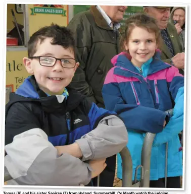  ??  ?? Tomas (6) and his sister Saoirse (7) from Hyland, Summerhill, Co Meath watch the judging at the Irish Angus Cattle Society Elite Show and Sale at Carrick-on-Shannon on Saturday