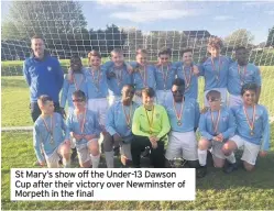  ??  ?? St Mary’s show off the Under-13 Dawson Cup after their victory over Newminster of Morpeth in the final