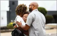  ?? AP PHOTO BY MARK WEBER/DAILY MEMPHIAN ?? People embrace outside a Walmart store following a shooting Tuesday, July 30, 2019, in Southaven, Miss. A gunman fatally shot two people and wounded a police officer before he was shot and arrested Tuesday at the Walmart in northern Mississipp­i, authoritie­s said.