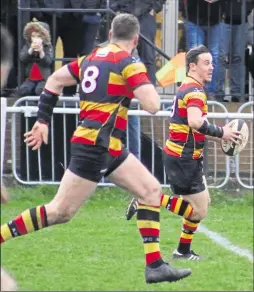  ??  ?? Above, Ashford’s Rhys Fussell makes a break against Foots Cray, supported by Logan Chandler, at Kinneys Field on Saturday