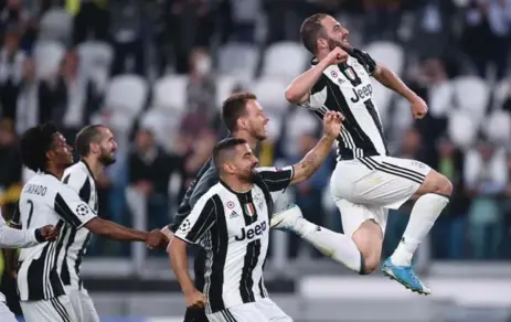  ?? FILIPPO MONTEFORTE/AFP/GETTY IMAGES ?? Juventus and Gonzalo Higuain, right, who scored twice in the semifinal first leg, will play in the Champions League final in Cardiff, Wales on June 3.