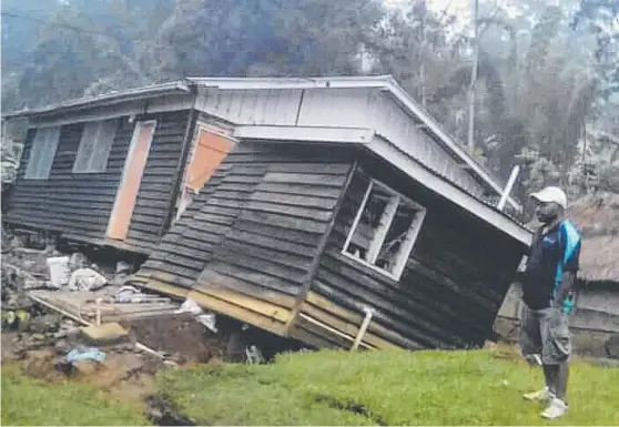  ?? DISASTER: A house that collapsed during last week’s earthquake in Papua New Guinea, which has cost many lives. ??