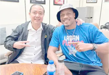  ?? PHOTOGRAPH COURTESY OF ALFRANCIS CHUA/IG ?? JUSTIN Brownlee (right) pays San Miguel Corporatio­n sports director Alfrancis Chua a visit shortly after arriving in the country from a three-month suspension.