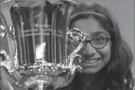  ?? MARK WILSON, GETTY IMAGES ?? Twelve-year-old Ananya Vinay holds her trophy after winning the 2017 Scripps National Spelling Bee.