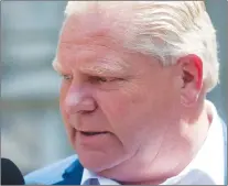  ?? CP PHOTO ?? Ontario Premier-designate Doug Ford speaks to reporters before heading into Whitney Block for a meeting with his transition team in Toronto, Sunday.