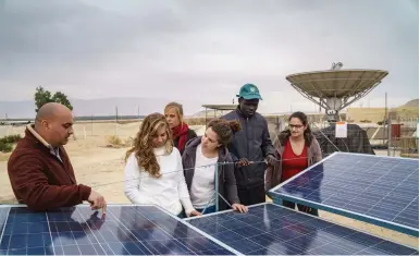  ?? (Marcos Schonholz) ?? STUDENTS AT the USAID-funded Arava Institute for Environmen­tal Studies, located on Kibbutz Ketura, use the desert as their classroom.