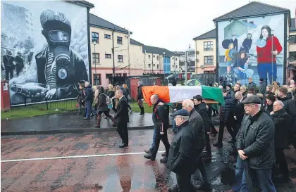  ?? Pictures / AP ?? Martin McGuinness’ coffin is carried through the Bogside area of Derry where, as a 20-year-old, McGuinness became an IRA commander.