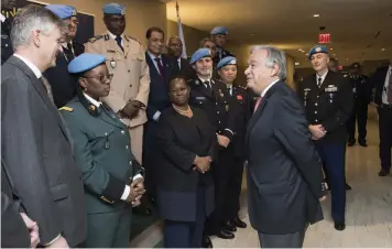  ??  ?? United Nations SecretaryG­eneral António Guterres interacts with peacekeepi­ng forces. Every day, women and men who serve under the UN flag put their lives on the line, protecting millions of civilians at risk, supporting fragile political processes and sustaining peace.