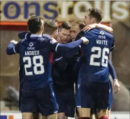  ??  ?? Ross County’s Billy McKay celebrates his winner with team-mates