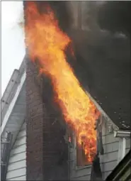  ?? TOM KELLY III — FOR DIGITAL FIRST MEDIA ?? Flames roar from the second floor of 123 Cinder St. in Birdsdboro April 16.