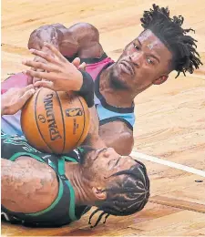  ?? MATTHEW J. LEE GETTY IMAGES FILE PHOTO ?? “We’re gonna fight, and we’re gonna come out on top,” said Miami’s Jimmy Butler, battling Boston’s Marcus Smart, about the teams facing each other in the Eastern Conference final starting Tuesday.