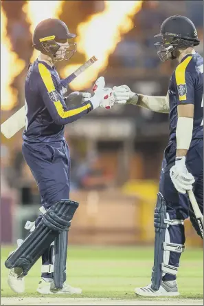  ?? PICTURE: ALLAN MCKENZIE/SWPIX.COM ?? FLAME THRILLED: Yorkshire’s Harry Brook and David Willey punch gloves against Derybshire after a boundary. But it was the visitors who prevailed by a 77-run margin.