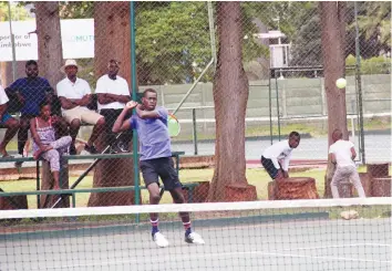  ??  ?? EYES ON THE BALL . . . Mehluli Sibanda returns the ball during the Select Healthcare Tennis Masters final against his brother Muzingaye at Harare Sports Club yesterday