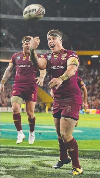  ?? Picture: GETTY IMAGES ?? Jarrod Wallace celebrates after scoring a try for the Maroons last year.