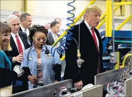 ?? Timothy A. Clary AFP/Getty Images ?? PRESIDENT TRUMP has touted a resurgent manufactur­ing sector as key to fueling economic growth, but many experts don’t see factories’ heyday returning.