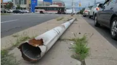  ?? JACK LAKEY/TORONTO STAR ?? A utility pole that was knocked over in a traffic accident has languished on a raised median in the middle of Ellesmere Rd. since last spring.