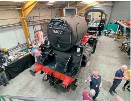  ?? ?? Visitors gather round BR Standard 4MT 2-6-0 No. 76077 during the shareholde­r open day at Locomotive Maintenanc­e Services in Loughborou­gh on September 3. IAN CROWDER