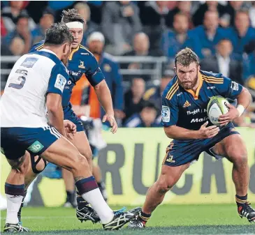  ?? Photo: GETTY IMAGES ?? Liam Coltman carries the ball for the Highlander­s against the Blues.