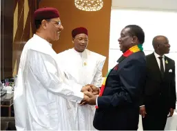  ?? ?? President Mnangagwa is welcomed byhis Niger counterpar­t President Mohamed Bazoum on arrival in Niamey, Niger, for the Africa Summit on industrial­isation and Economic Diversific­ation.