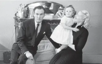  ?? Picture: Joseph McKeown/via Getty Images ?? Former safe-cracker and wartime British double agent Eddie Chapman with his wife Betty Farmer and their daughter Suzanne in 1957.