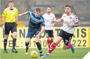  ??  ?? Forfar scorer Danny Denholm on the ball at Station Park.