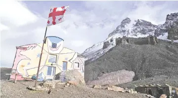  ?? — Reuters photo ?? A Georgian flag flies at the base camp of Mount Kazbek in Mtskheta-Mtianeti region, Georgia.