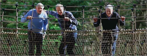  ?? Photo by Valerie O’Sullivan. ?? Olympic Gold Medalist Ronnie Delany, environmen­talist Tim Smit, and Billy Alexander on Ireland’s longest rope bridge at Kells Bay.