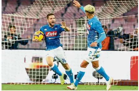  ?? — AFP ?? Supersub to the rescue: Napoli’s Dries Mertens (left) celebratin­g with teammate Kevin Malcuit after scoring a goal during the Serie A match against Roma on Sunday.