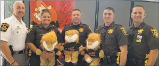  ?? CCSO PHOTO ?? Charles County Sheriff’s Office Lt. Scott Grove, left, and Sgt. Jared Cooney, right, pose with Maryland D.A.R.E. Officer Training graduates, from center left, Pfc. Jennifer Brown, Pfc. Stefan Hillman and Pfc. Shawn Joffe.