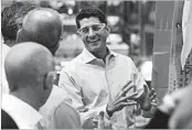  ?? ELAINE THOMPSON/AP ?? House Speaker Paul Ryan talks with Boeing workers Thursday while on a tour of the airplane factory in Everett, Wash.