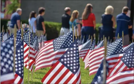  ?? CARLY STONE — MEDIANEWS GROUP ?? 343 American flags were placed on the front lawn of Oneida City Hall to remember the number of firefighte­rs lost during the terror attacks on 9/11. Photo taken Sept. 11, 2021.