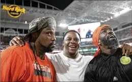  ?? ALLEN EYESTONE / THE PALM BEACH POST ?? From left: Former Canes Warren Sapp, Clinton Portis and Ed Reed get together before No. 7 Miami beat No. 3 Notre Dame, boosting its chances of moving up in the College Football Playoff rankings.